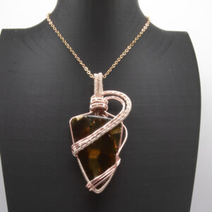 Indonesian Red Amber Wrapped in Rose Gold wire on an 18" chain
