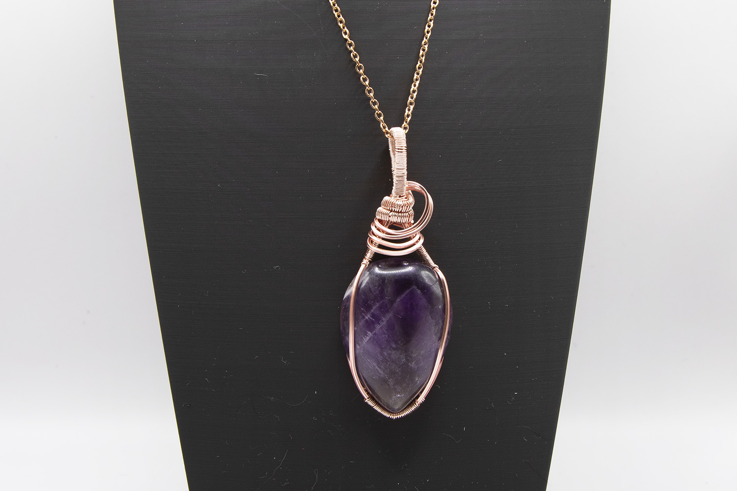 Amethyst in rose gold wire