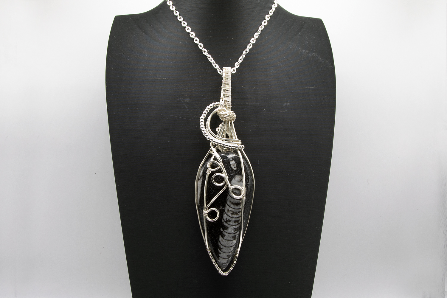 Orthoceras Fossil wrapped in silver pated wire