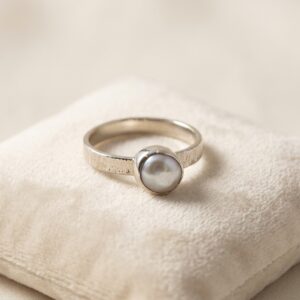 Handmade freshwater pearl ring with a natural lustrous pearl in fine silver and an organic textured sterling silver shank.