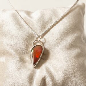 Hand-polished Red Opal necklace in a handcrafted fine and sterling silver setting with an 18-inch sterling silver chain.