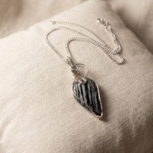 Silver Leaf Obsidian necklace featuring a natural black leaf-shaped stone wrapped in silver-plated wire with an 18-inch chain.