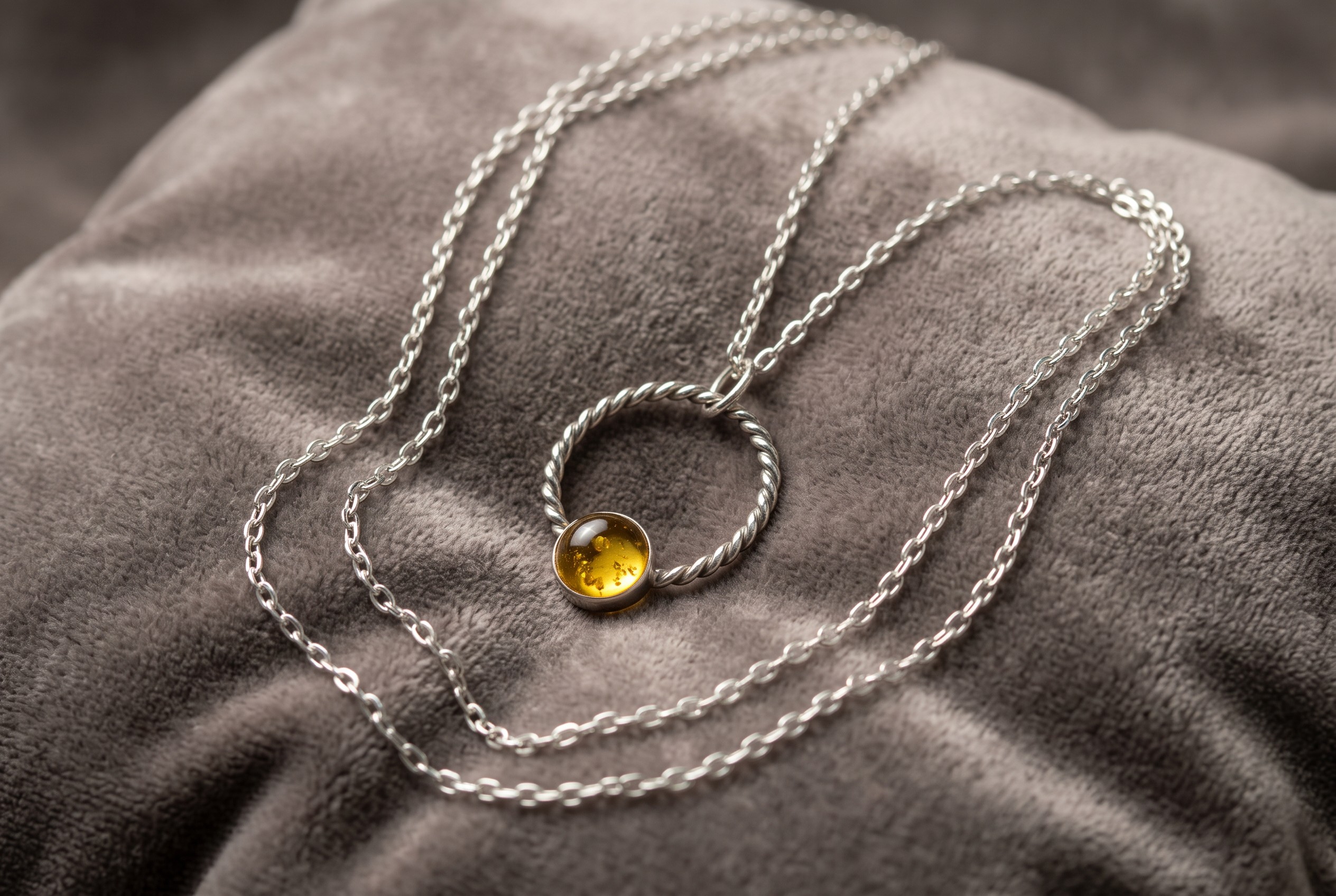 Handmade citrine necklace with an 8mm golden citrine cabochon set in sterling silver with a large twisted silver loop.